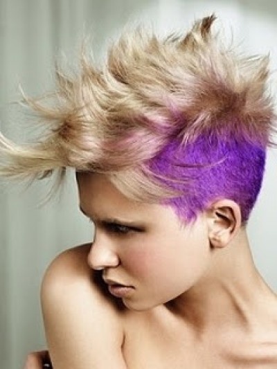 Half shaved fauxhawk hairstyle with blond and purple colouring